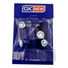 A blue packet labeled CDC NSW containing pieces of purple candy with white centers.