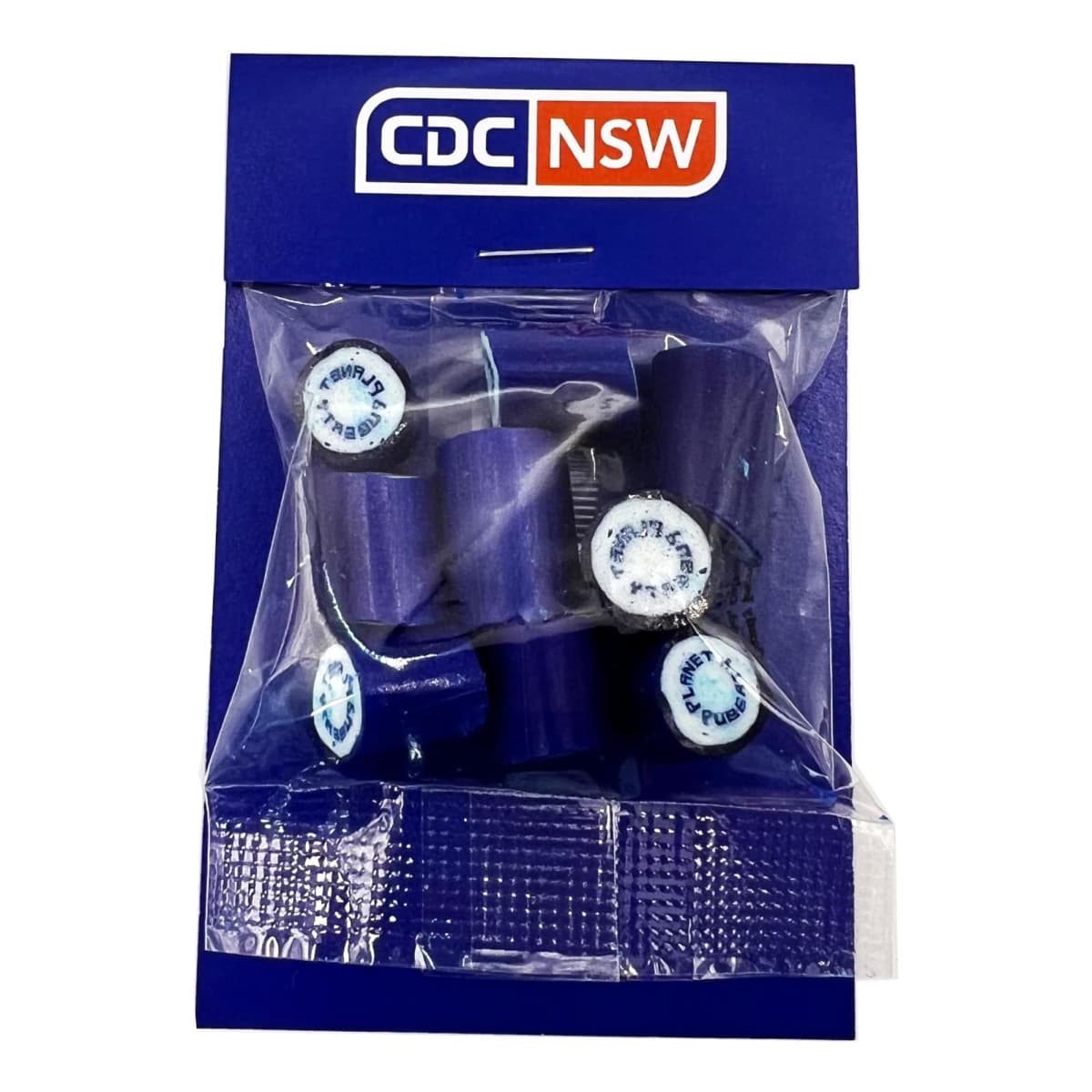 A blue packet labeled CDC NSW containing purple candies with white centers.