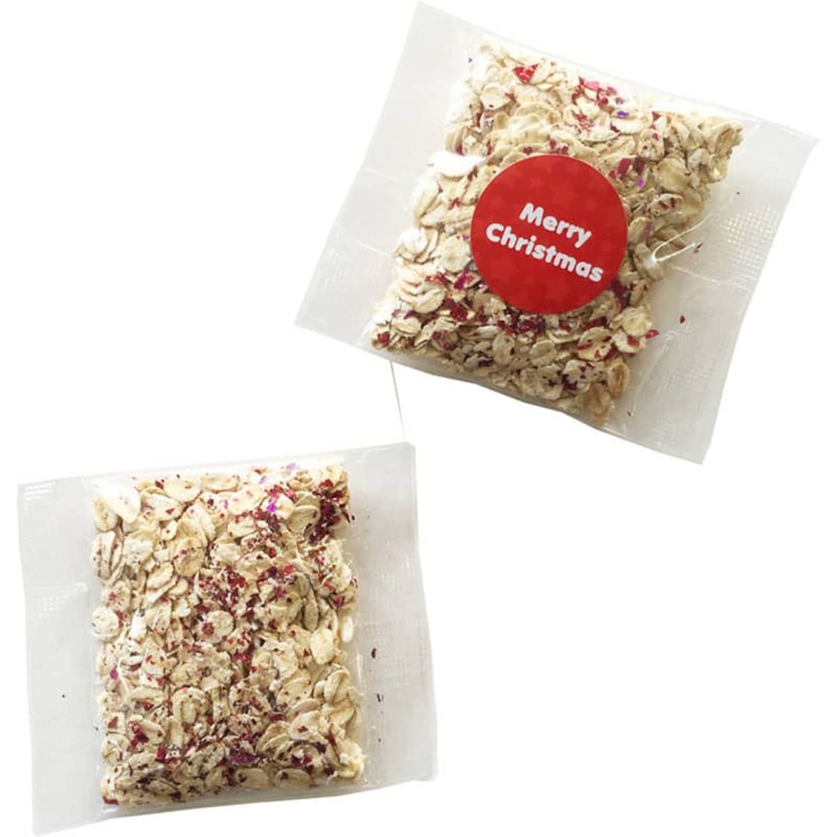 Two clear packets with oats and dried fruit; one has a red Merry Christmas sticker.