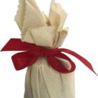 Fabric-wrapped bundle tied with a red ribbon bow.