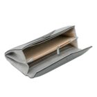 Silver wallet open, showing compartments and a zippered pocket inside.