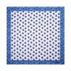 Blue floral square scarf with a white center and blue flower pattern, bordered by solid blue.