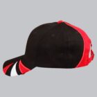 Black and red baseball cap with white and red accents on the brim, side view.