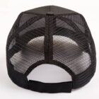 Black mesh trucker hat viewed from the back, showing adjustable strap and breathable panels.