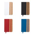 Four notebooks in white, black, red, and blue with cork accents and matching ribbons.