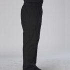 Person wearing black cargo pants and black shoes, standing sideways against a plain background.