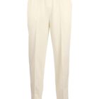 Cream-colored, straight-cut trousers with an elastic waistband and drawstring.