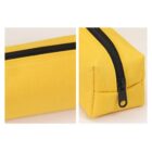 Close-up of a yellow rectangular pouch with a black zipper.
