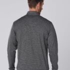 Man wearing a gray long-sleeve shirt, standing with his back facing the camera.