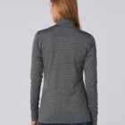 Woman with long hair wearing a gray long-sleeve top, shown from the back.