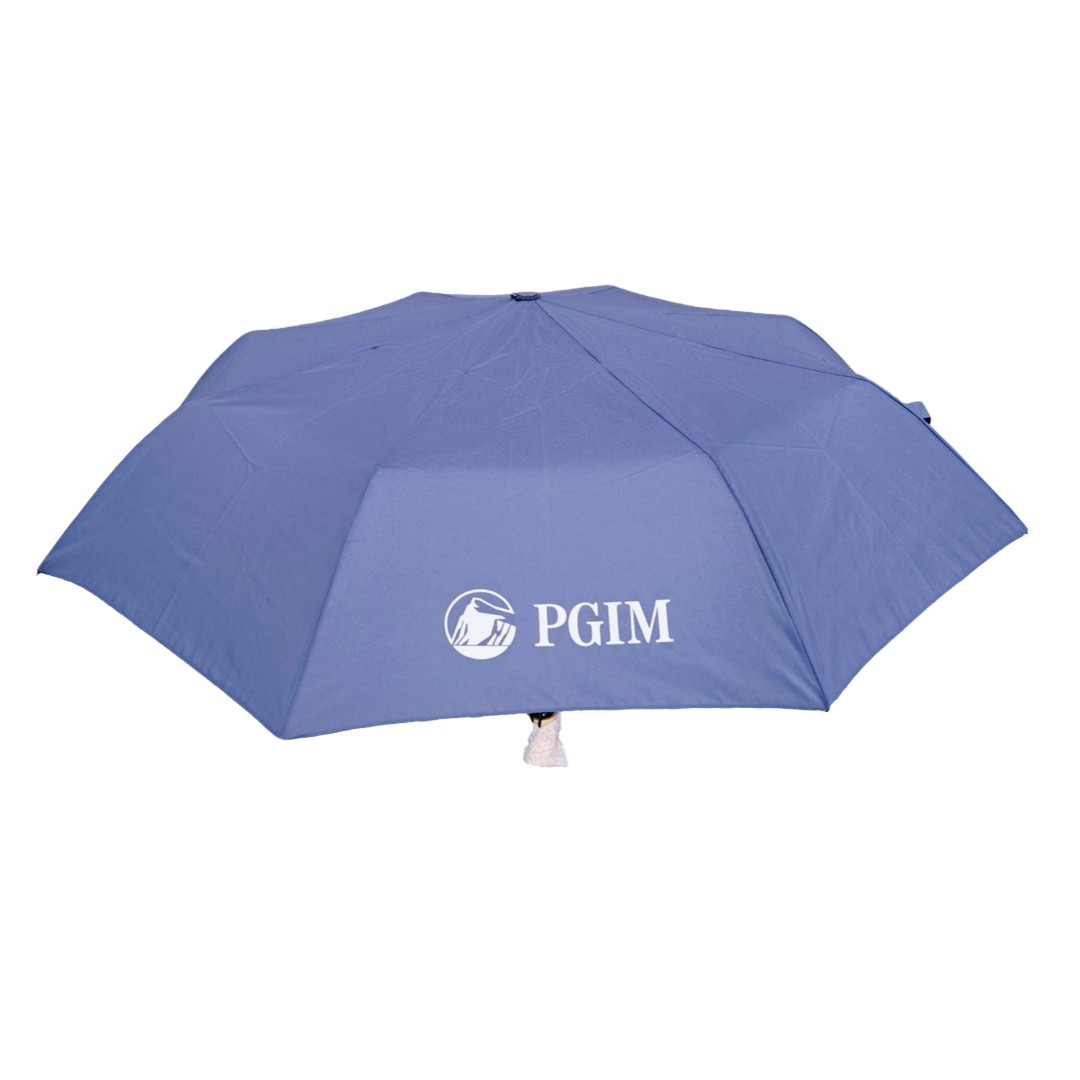 Blue umbrella with the white PGIM logo printed on its canopy.