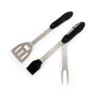 Two stainless steel barbecue tools with black handles, including spatula, fork, and brush.