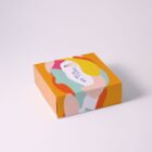 A colorful rectangular box with abstract patterns and a Skill Up label on top.