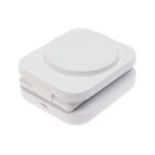 A compact, white, square-shaped wireless charging pad on a white background.
