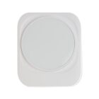 A square white device with a large circular button or surface in the center.
