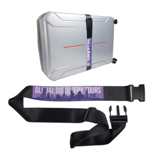 A black luggage strap labeled Global Discovery Tours around a silver suitcase.