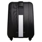 Black hard-shell suitcase with a white vertical stripe and four wheels, viewed from the back.