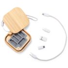 Wooden case with cable and three USB adapters on a white background.