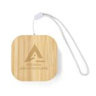 Square bamboo keychain with a wrist strap and Arcadia Architectures logo on top.