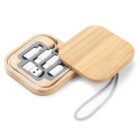 Wooden case with USB adapters and a charging cable inside, lid partially open.