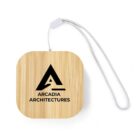 Square bamboo keychain with Arcadia Architectures logo and a white wrist strap.