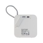 Back view of a white Bluetooth speaker with a strap and charging port visible.