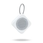 White portable speaker with a circular grill and a looped carrying strap, on a white background.