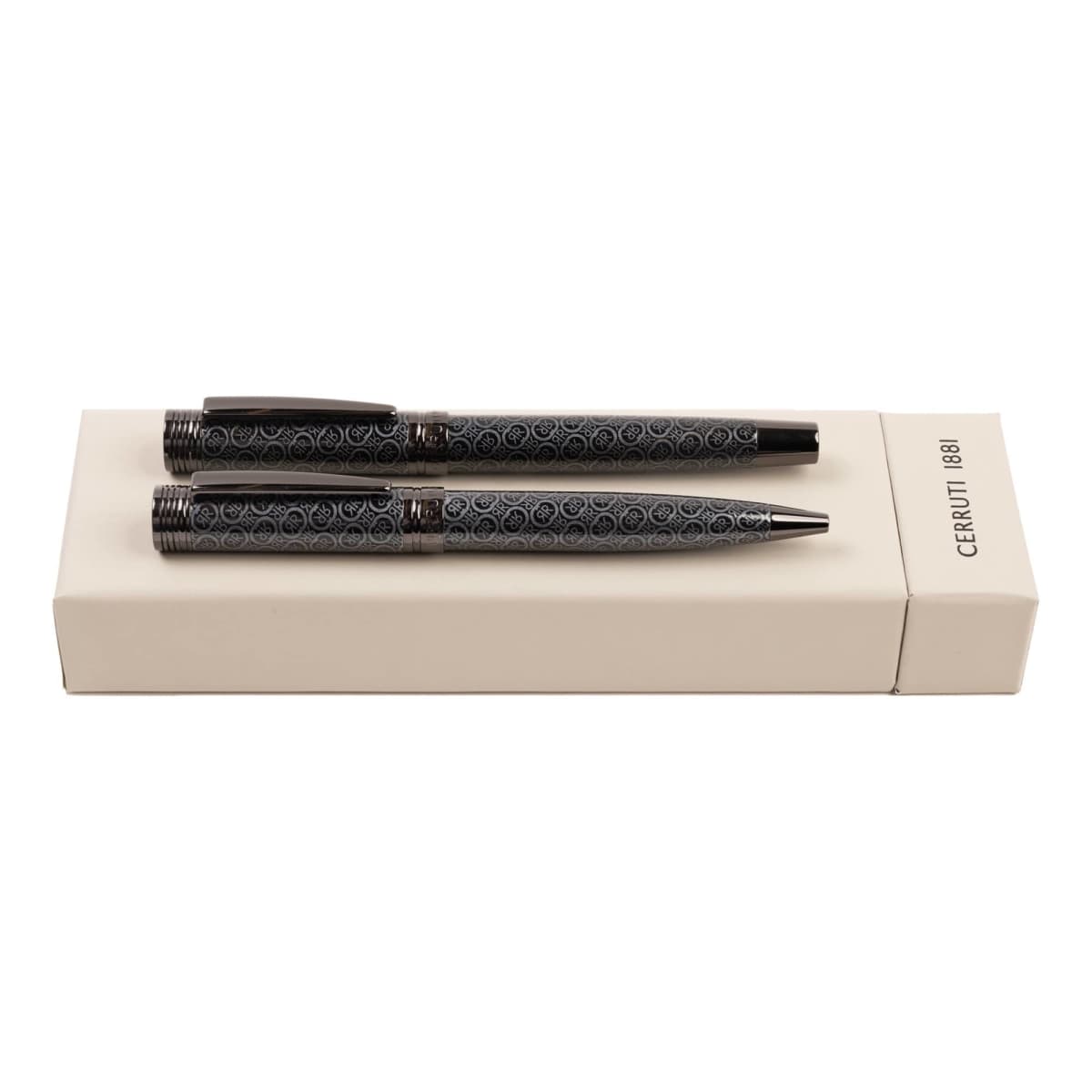 Two patterned black pens on a cream-colored Cerruti 1881 box.
