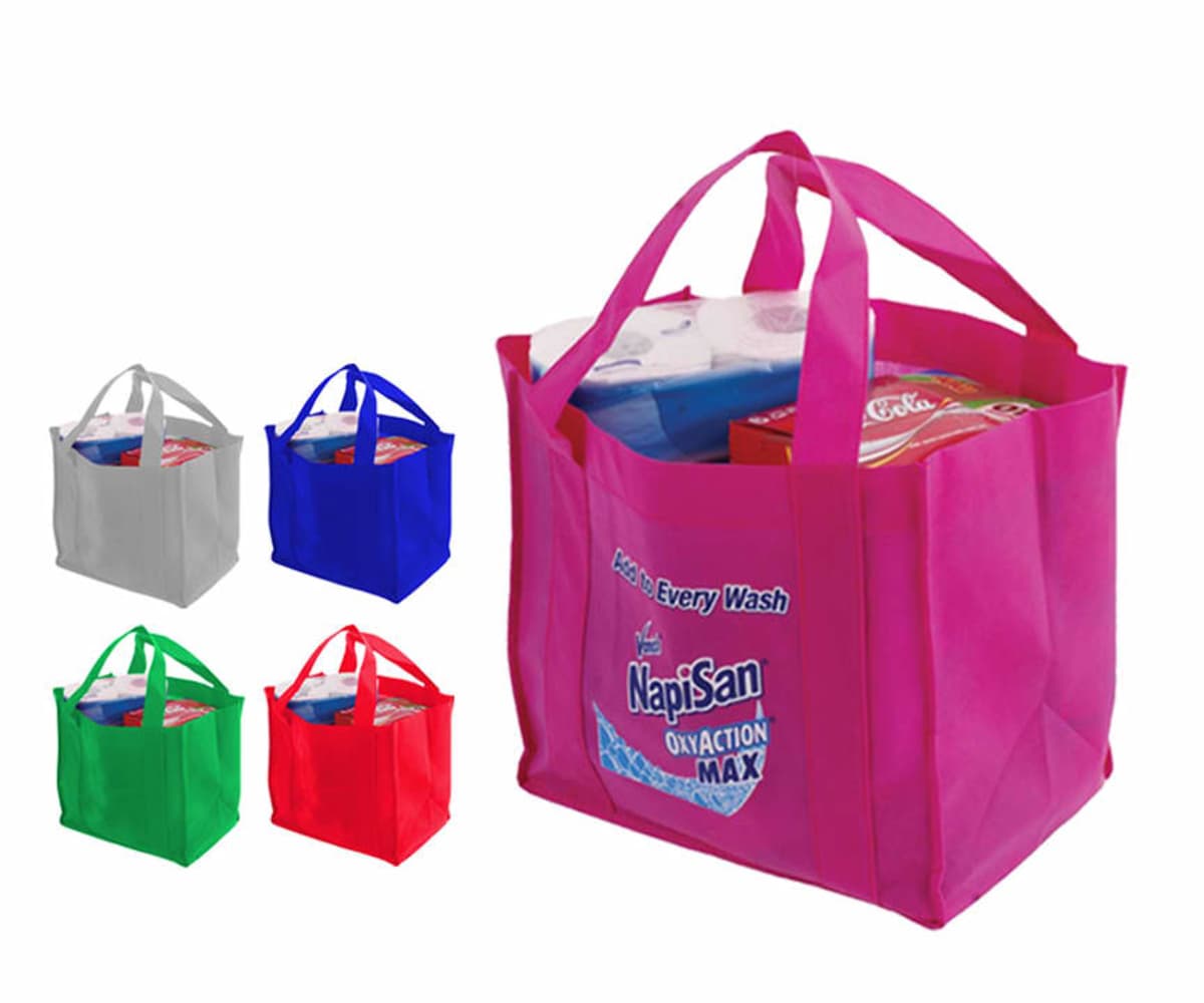 Five reusable shopping bags in pink, gray, blue, green, and red, filled with groceries.