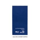 A blue quilted dinner napkin labeled La Paparedda with food safe and compostable icons.