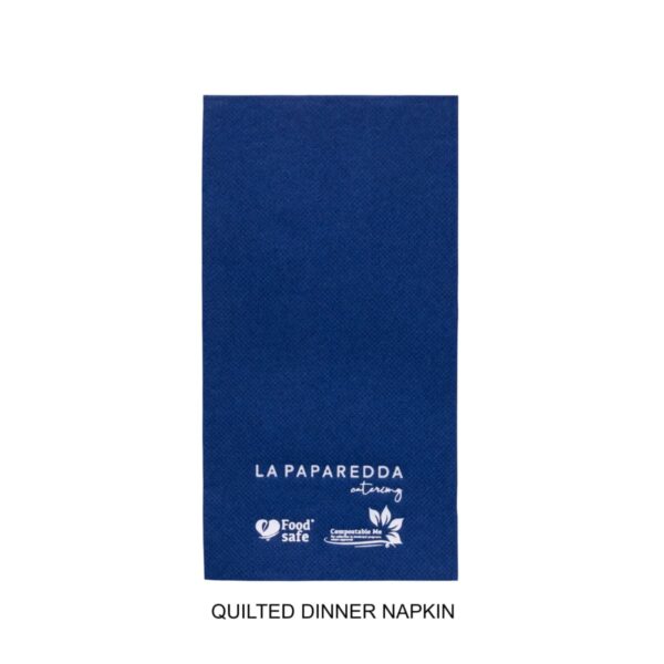 A blue quilted dinner napkin labeled La Paparedda with food safe and compostable icons.