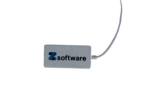 A white rectangular device labeled Z software with a cable attached.