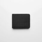 A closed black fabric wallet on a plain white background.