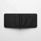 An open, empty black fabric wallet on a white background.