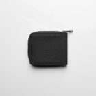 A closed black fabric wallet with a zipper, placed on a white background.