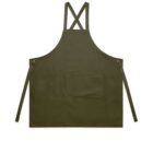 Olive green apron with front pocket and cross-back straps, laid flat on a white background.