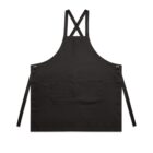 Black apron with front pockets and crisscross straps, lying flat on a white background.