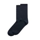 A pair of plain, black crew socks laid flat on a white background.