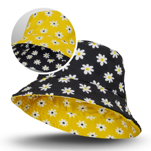 Aero Reversible Bucket Hat features white daisies on yellow and black backgrounds.