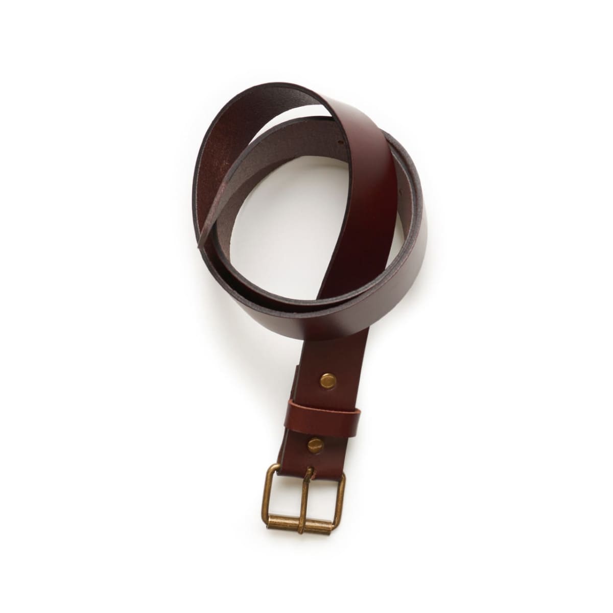 A coiled brown leather belt with a brass buckle on a white background.