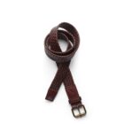 A brown woven leather belt with a gold buckle, coiled on a white background.