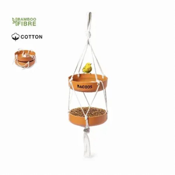 Two-tiered hanging bird feeder with a yellow bird perched on the upper tier.