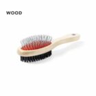 Double-sided wooden brush with metal bristles on one side and black bristles on the other.
