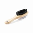 Wooden double-sided brush with black bristles on one side and metal pins on the other.