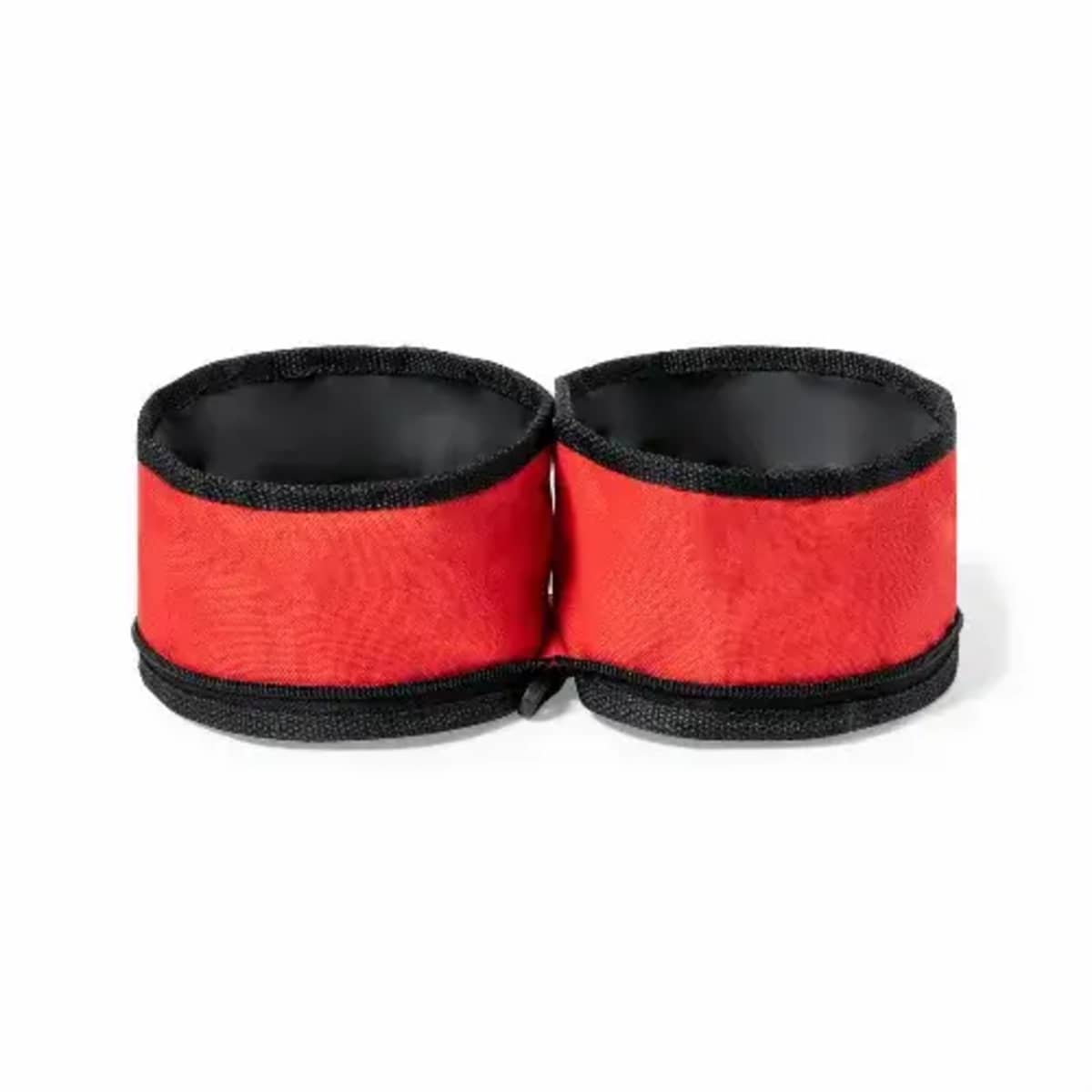 Two red and black fabric wrist or ankle cuffs joined together.