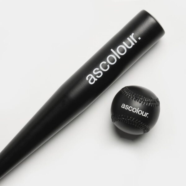Black baseball bat and ball with ascolour. logo on a white background.