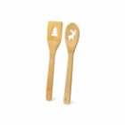 Two wooden utensils with cutout shapes, a tree on one and a reindeer on the other.