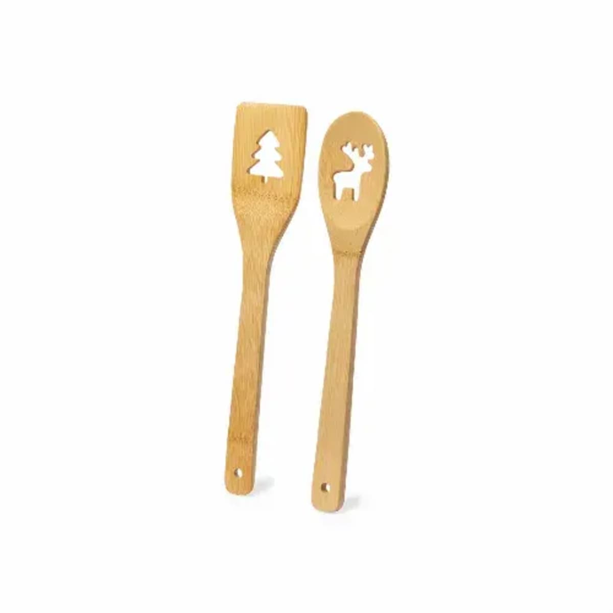 Two wooden utensils with cutout shapes, a tree on one and a reindeer on the other.