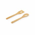 Two wooden kitchen utensils with cutouts: one of a tree, one of a reindeer.