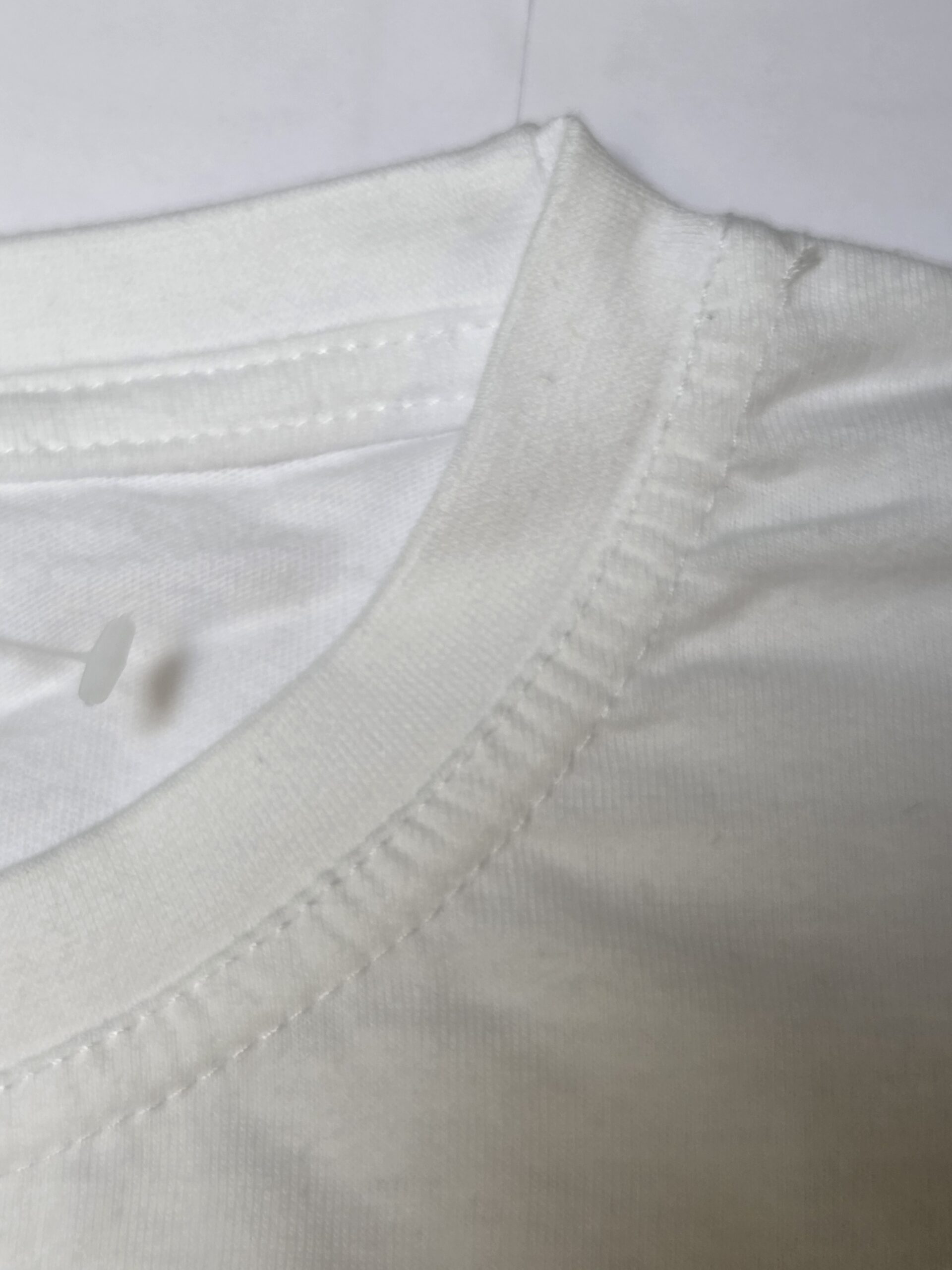 Zoomed-in image showing the collar of a white shirt